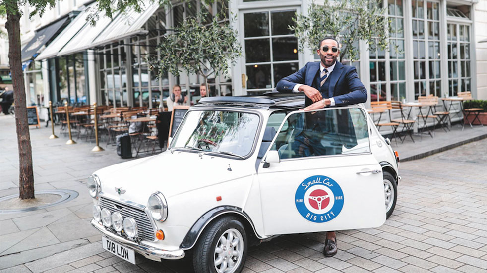 Classic Mini road trip man with white Mini